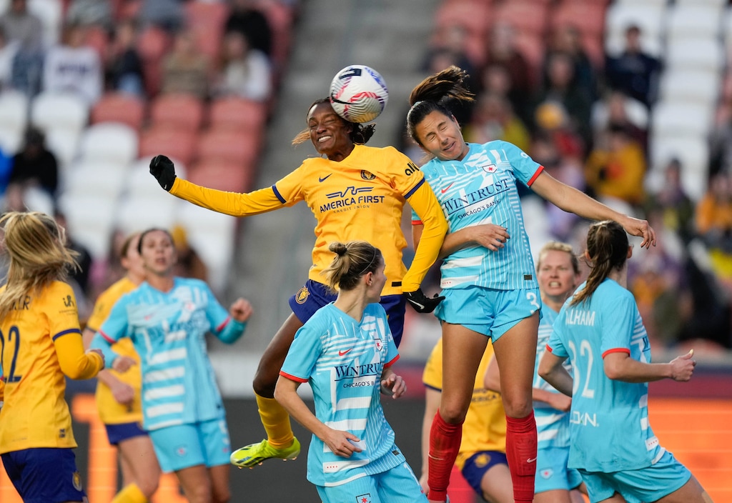 (Francisco Kjolseth  |  The Salt Lake Tribune) Utah Royals forward Ify Onumonu gets a header on goal over Chicago Red Stars defender Arin Wright (3) during their season opener at America First Field Saturday, March 16, 2024, in Sandy, Utah.