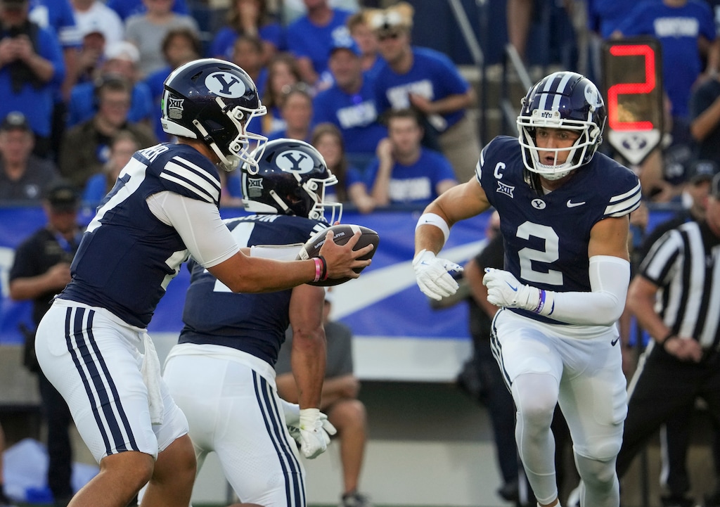 (Bethany Baker  |  The Salt Lake Tribune) Brigham Young Cougars quarterback Bear Bachmeier (47) and wide receiver Chase Roberts (2) during a game in Provo earlier this season.