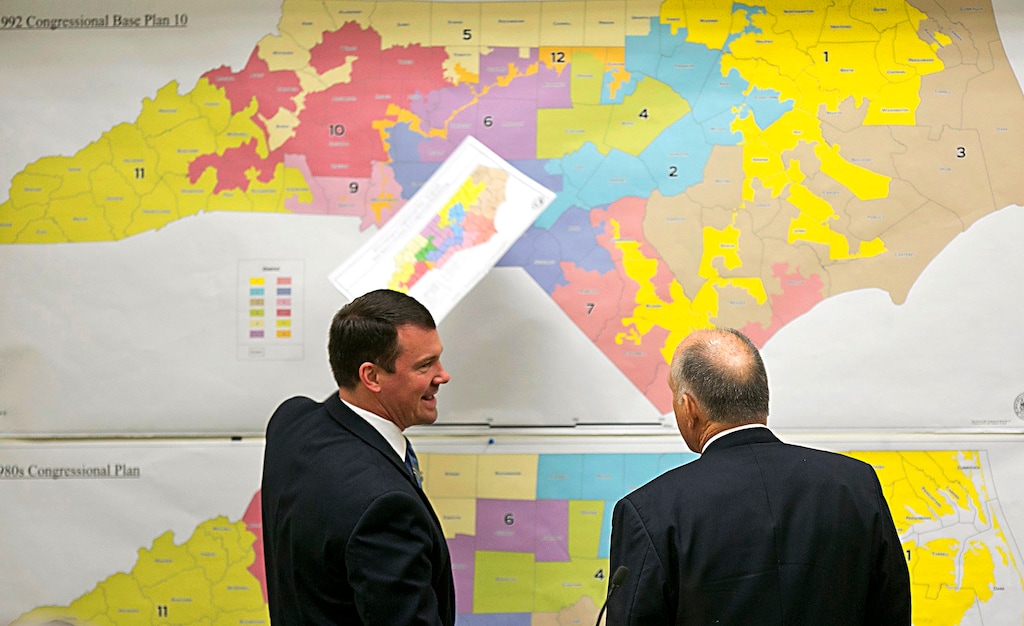 FILE - In this Feb. 16, 2016, file photo, Republican state Sens. Dan Soucek, left, and Brent Jackson, right, review historical maps during The Senate Redistricting Committee for the 2016 Extra Session in the Legislative Office Building at the N.C. General Assembly, in Raleigh, N.C. Federal judges ruled Tuesday, Jan. 9, 2018, that North Carolina's congressional district map drawn by legislative Republicans is illegally gerrymandered because of excessive partisanship that gave GOP a rock-solid advantage for most seats and must quickly be redone. (Corey Lowenstein/The News & Observer via AP, File)