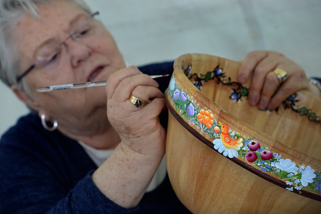 ( Scott Sommerdorf | Salt Lake Tribune file photo) Hella Pope paints a bowl in a traditional German style at the 2017 Living Traditions Festival in 2017. The festival will return in May 2021, with five smaller events around Salt Lake City, after a year off because of the COVID-19 pandemic.