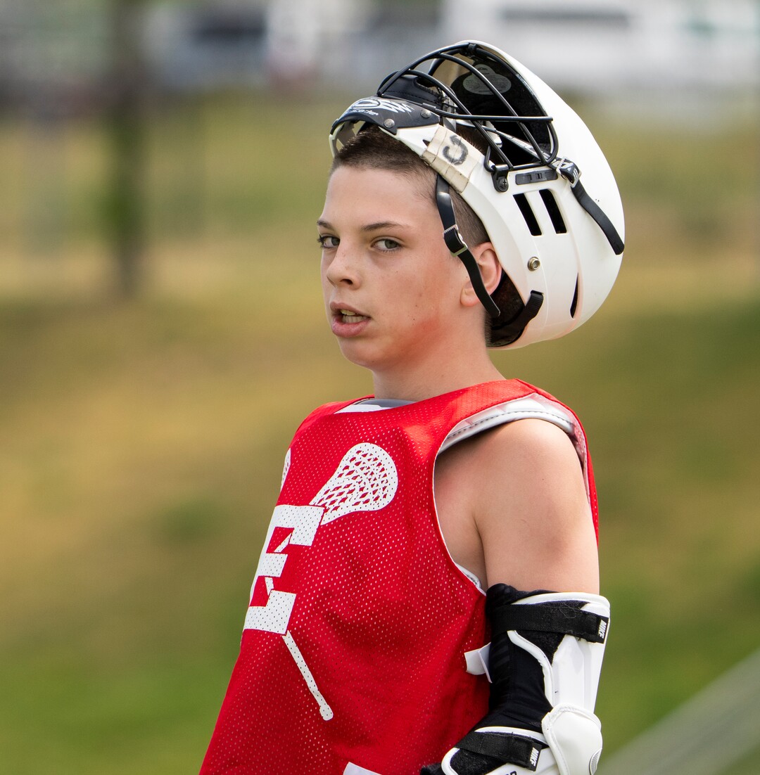 (Rick Egan | The Salt Lake Tribune)  Pete Killilea takes a break, in East youth lacrosse practice, on Wednesday, June 22, 2022.