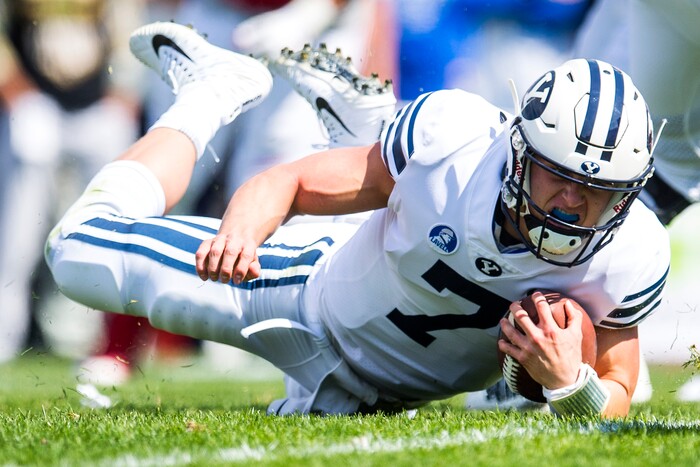 (Chris Detrick  |  The Salt Lake Tribune)   Brigham Young Cougars quarterback Beau Hoge (7) falls to the ground during the game at LaVell Edwards Stadium Saturday Saturday, September 16, 2017. Wisconsin Badgers are leading Brigham Young Cougars 24-6 at halftime.