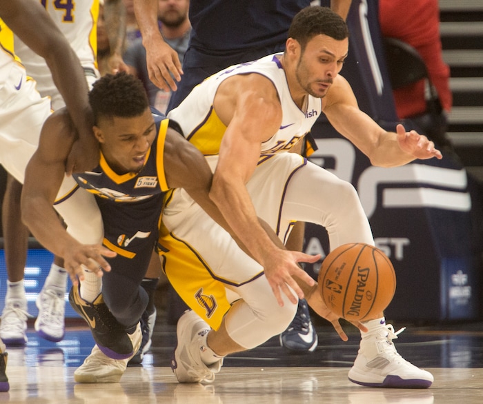 (Rick Egan  |  The Salt Lake Tribune)   Utah Jazz guard Donovan Mitchell (45) goes for a loose ball along with Los Angeles Lakers forward Larry Nance Jr. (7), in NBA action, Utah Jazz vs. Los Angeles Lakers, in Salt Lake City, Saturday, October 28, 2017.