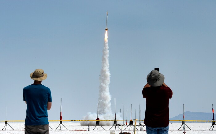 (Scott Sommerdorf   |  The Salt Lake Tribune)   Spectators watch rockets launch on the Bonneville Salt Flats during "HellFire" — the event sponsored by the Utah Rocket Club on Saturday, Aug. 5, 2017.