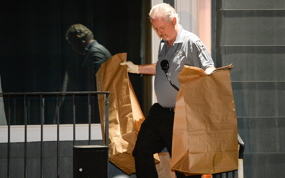 (Francisco Kjolseth  |  The Salt Lake Tribune)  Police investigators remove multiple bags of evidence during their search of a home at 547 N. 1000 West in Salt Lake City as part of the disappearance of University of Utah student MacKenzie Lueck that carried on into the early morning hours of Thursday, June 27, 2019.