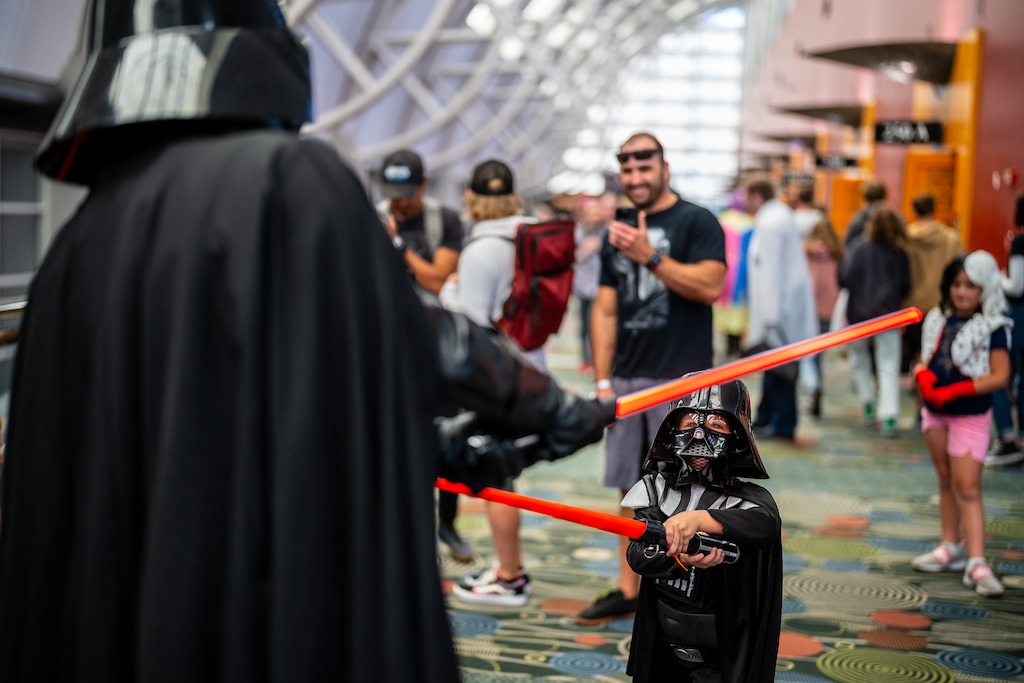 (Trent Nelson  |  The Salt Lake Tribune) A young Darth Vader (Weston Charleson) takes on his older self at FanX Salt Lake Comic Convention on Thursday, Sept. 22, 2022, in the Salt Palace Convention Center in Salt Lake City.