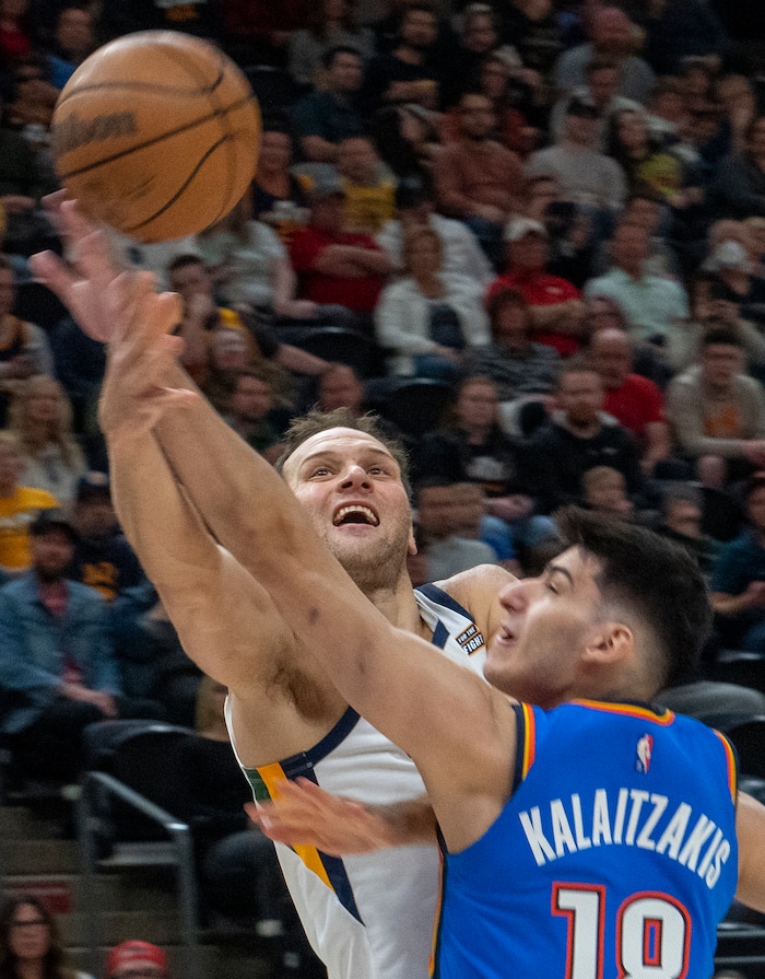 (Rick Egan | The Salt Lake Tribune) Utah Jazz forward Bojan Bogdanovic (44) shoots as Oklahoma City Thunder forward Georgios Kalaitzakis (18) defends, in NBA action between the Utah Jazz and the Oklahoma City Thunder at Vivint Arena, on Wednesday, April 6, 2022.
