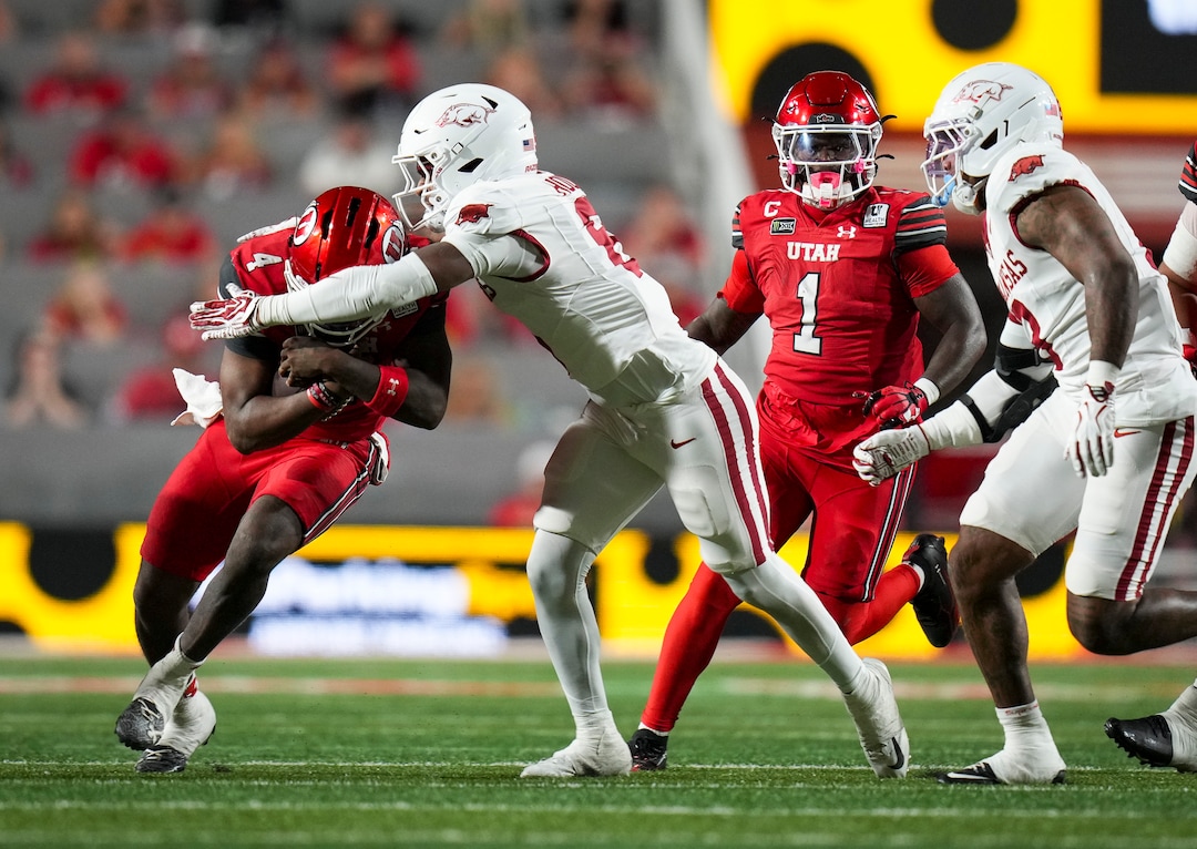 (Bethany Baker  |  The Salt Lake Tribune) Arkansas Razorbacks linebacker Phoenix Jackson (8) tackles Utah Utes quarterback Devon Dampier (4) during the game between the Utah Utes and the Arkansas Razorbacks in Salt Lake City on Saturday, Sept. 12, 2026.