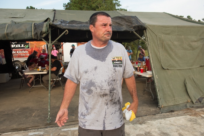 (Rachel Molenda  |  The Salt Lake Tribune) John Clayton, of Moab, Utah, takes a short break from cooking at the Sunset Grill mobile kitchen in Kountze, Texas, on Tuesday, Sept. 5, 2017. Clayton, with his wife and daughter, drove their kitchen from Moab to Kountze to feed people after Hurricane Harvey hit the region.