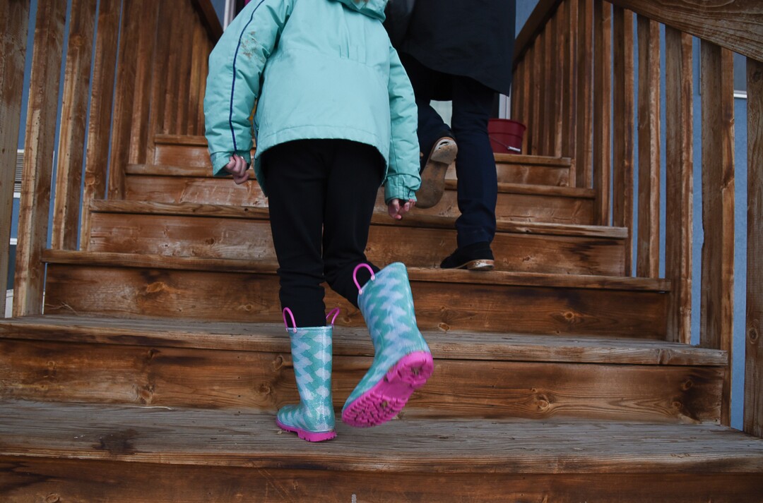 (Francisco Kjolseth  |  The Salt Lake Tribune)  Skyrie Sacks, 7, marches back inside after cleaning poop off her rubber boots after visiting with the family's eight chickens at their home in West Clinton on Wednesday, Jan. 9, 2018. Natalie Sacks says emotional support chickens have helped her daughter deal with PTSD from a traumatic accident that happened when she was 4. The Sacks family had to move from their home in Herriman because of an HOA dispute over the chickens.