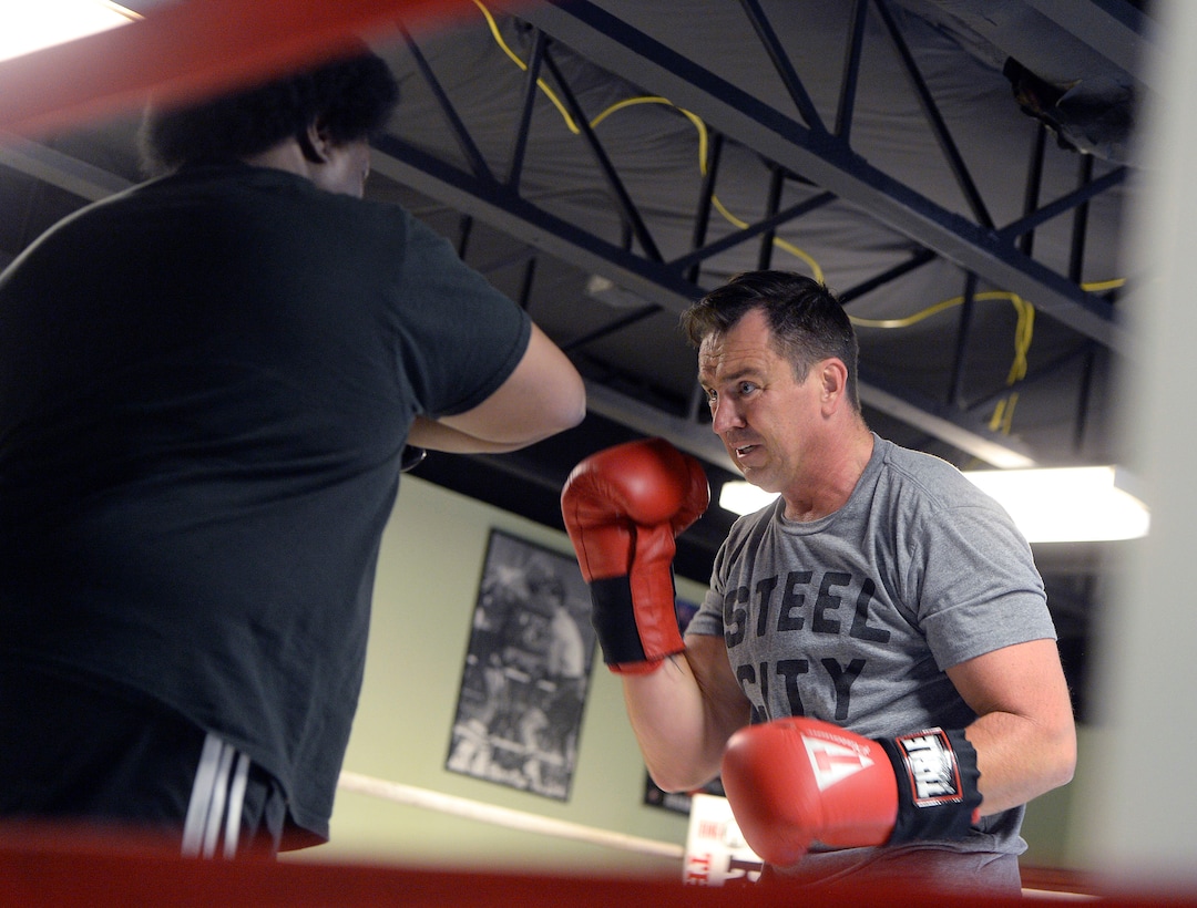 (Al Hartmann  |  The Salt Lake Tribune) House Speaker Greg Hughes spars with Eddie "Flash" Newman during his workout at the Flash Academy gym in Holladay Tuesday August 29.  He's among a handful of local politicians, police and lobbyists who will box in a series of charity matches to benefit a national group that works to end domestic violence.