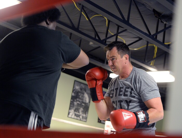(Al Hartmann | The Salt Lake Tribune)
House Speaker Greg Hughes spars with Eddie "Flash" Newman during his workout at the Flash Academy gym in Holladay Tuesday August 29. He's among a handful of local politicians, police and lobbyists who will box in a series of charity matches to benefit a national group that works to end domestic violence.