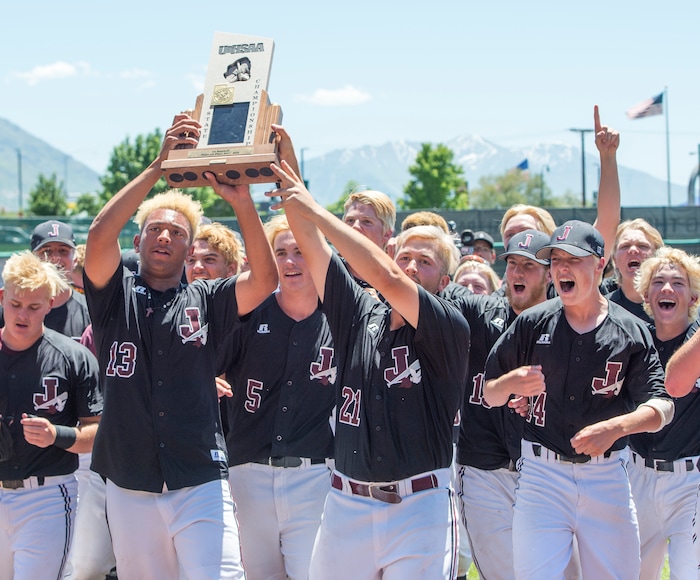 (Rick Egan  |  The Salt Lake Tribune)   Jordan High celebrates their 11-1 win over Olympus, for the 5A state baseball championship, at UVU in Orem, Friday, May 25, 2018.