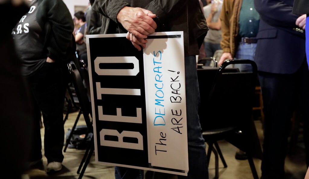 A supporter of senate hopeful Beto O'Rourke holds a sign during a Democratic watch party following the Texas primary election, Tuesday, March 6, 2018, in Austin, Texas. (AP Photo/Eric Gay)