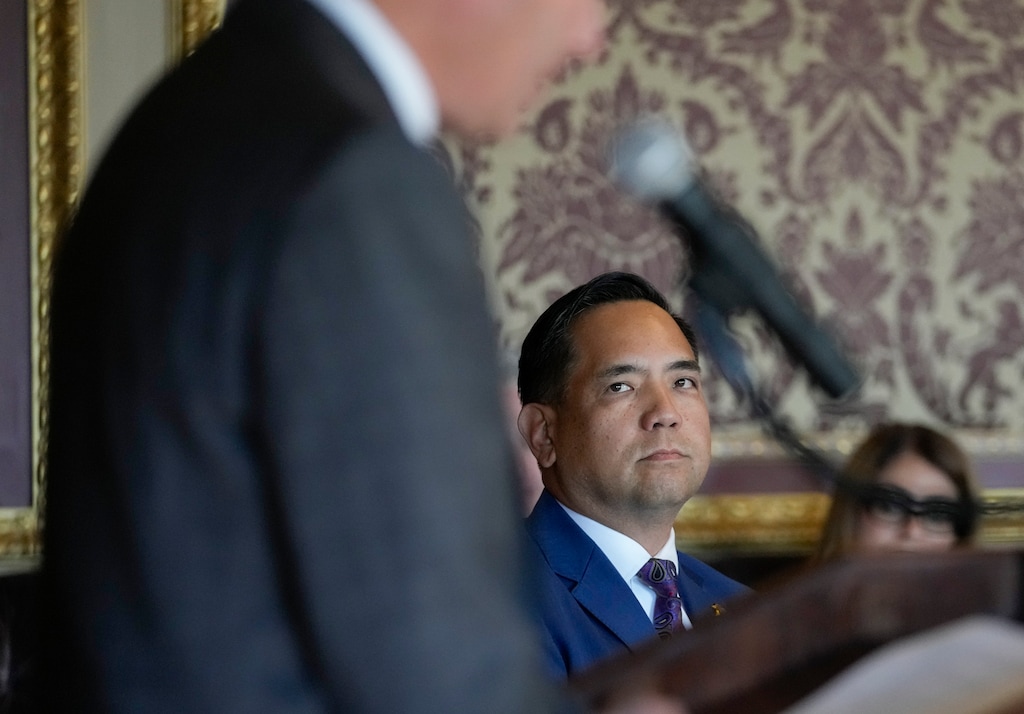 (Bethany Baker  |  The Salt Lake Tribune) Utah Attorney General Sean Reyes listens to Gov. Spencer Cox during at the Utah Capitol in Salt Lake City on Tuesday, Oct. 10, 2023. Reyes says he did not try to intimate a critic of his friend Tim Ballard.