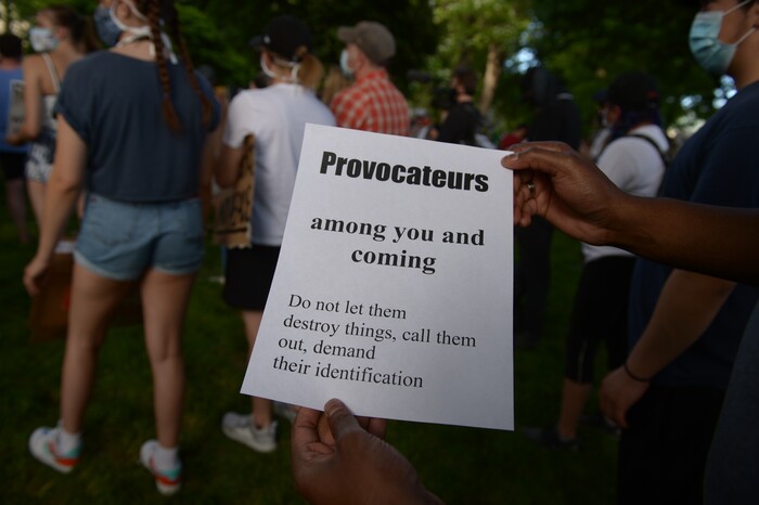 (Leah Hogsten  |  The Salt Lake Tribune)  Signs were handed out to protestors requesting a peaceful protest against police brutality in Salt Lake City on Monday, June 1, 2020.