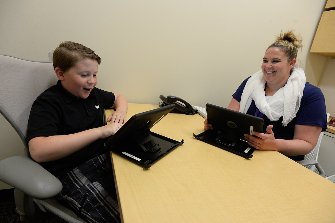 Francisco Kjolseth | The Salt Lake TribuneBryce Hortin, 11, of Syracuse takes a series of cognitive tests with the help of Kirsten Cline at the University of Utah. Hortin who is interested in science, decided to participate in a 10-year study to monitor changes to his brain.