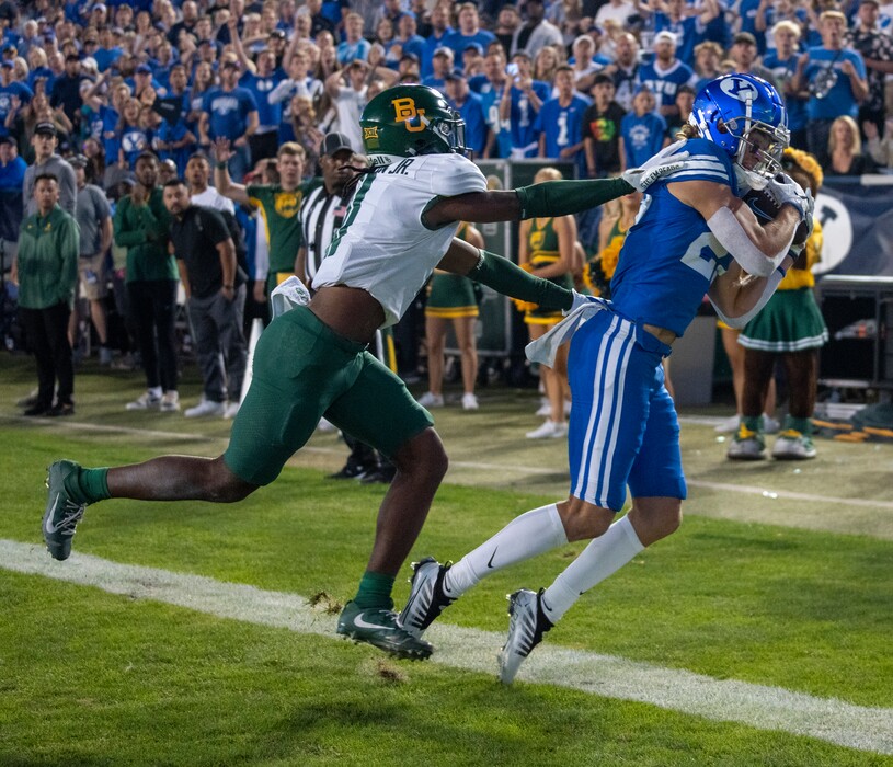 (Rick Egan | The Salt Lake Tribune)  Brigham Young wide receiver Chase Roberts (27) catches a pass in the end zone for the Cougars, as Baylor Bears cornerback Lorando Johnson (11) defends,  in football action between the Brigham Young Cougars and the Baylor Bears at Lavell Edwards Stadium in Provo, on Saturday, Sept. 10, 2022.