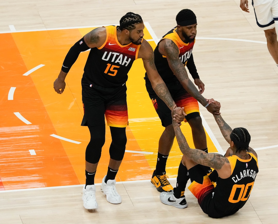 (Francisco Kjolseth | The Salt Lake Tribune) Utah Jazz center Derrick Favors (15) and Utah Jazz forward Royce O'Neale (23) help Utah Jazz guard Jordan Clarkson (00) off the floor in the first half of Game 5 of an NBA basketball first-round playoff series Wednesday, June 2, 2021, in Salt Lake City, UT, against the Memphis Grizzlies.