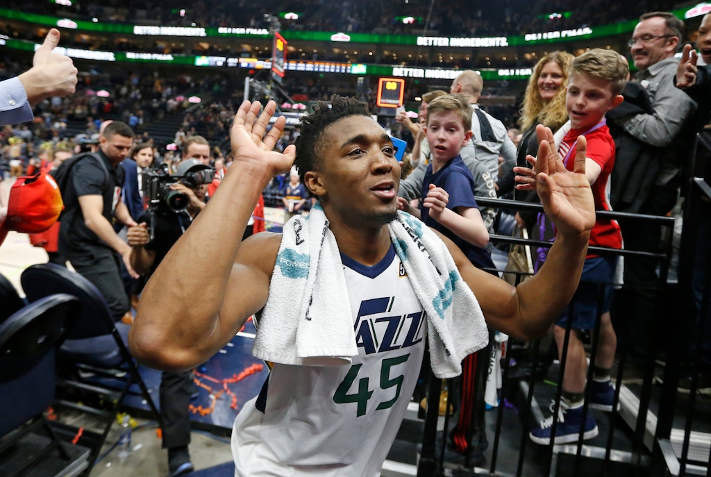 Utah Jazz guard Donovan Mitchell (45) celebrates as he runs off the court following their NBA basketball game against the San Antonio Spurs Monday, Feb. 12, 2018, in Salt Lake City. The Jazz won 101-99. (AP Photo/Rick Bowmer)