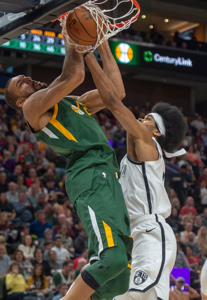 (Rick Egan  |  The Salt Lake Tribune)   Utah Jazz center Rudy Gobert (27) dunks the ball over Brooklyn Nets center Jarrett Allen (31) in NBA action between Utah Jazz and Brooklyn Nets at Vivint Smart Home Arena, Saturday, March 16, 2019.


