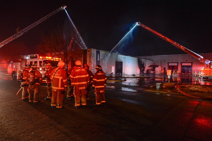 (Francisco Kjolseth | The Salt Lake Tribune) Crews from multiple agencies battled a fire Sunday night that broke out at South Valley Specialties at 9320 S. 547 West in Sandy. The building, where the company makes custom rubber moldings and other products, was declared a complete loss. The cause of the blaze is under investigation.