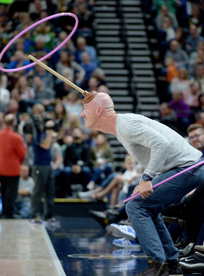(Leah Hogsten  |  The Salt Lake Tribune) Former Salt Lake City Police Chief Chris Burbank plays along with Jazz Bear during a time out.  The Utah Jazz were defeated by the Toronto Raptors 100-109 at Vivint Smart Home Arena, Friday, November 3, 2017