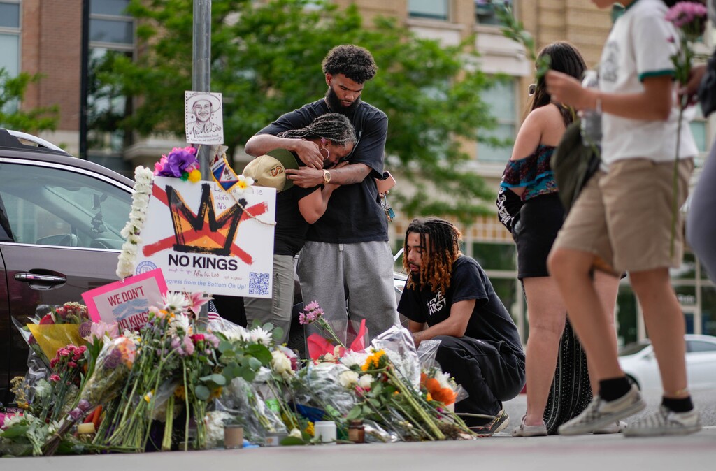(Francisco Kjolseth | The Salt Lake Tribune) People mourn Arthur Folasa Ah Loo near the Wallace F. Bennett Federal Building in Salt Lake City where he was killed on Monday, June 16, 2025. Ah Loo was an innocent bystander shot during the “No Kings” demonstration downtown on Saturday night.