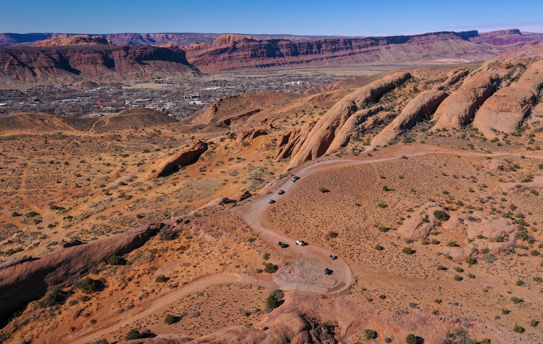 (Leah Hogsten | The Salt Lake Tribune) Several off-road utility terrain vehicles (UTVs) motor the Hell's Revenge 4x4 Trail at the Sand Flats Recreation Area trail, located just 4 miles from downtown Moab, Feb. 19, 2021.