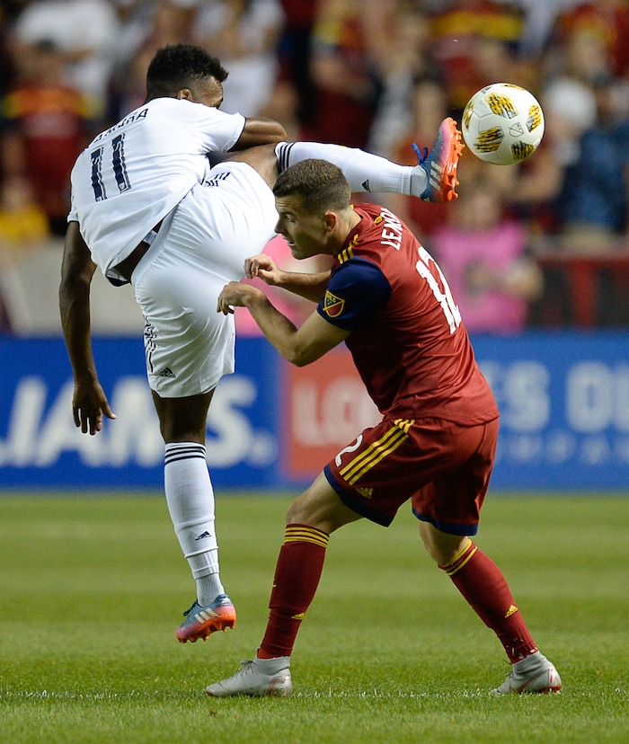 (Francisco Kjolseth  |  The Salt Lake Tribune)  Los Angeles Galaxy forward Ola Kamara (11) shoots past Real Salt Lake forward Brooks Lennon (12) during the first half of the MLS soccer match Saturday, Sept. 1, 2018, in Sandy at Rio Tinto Stadium.