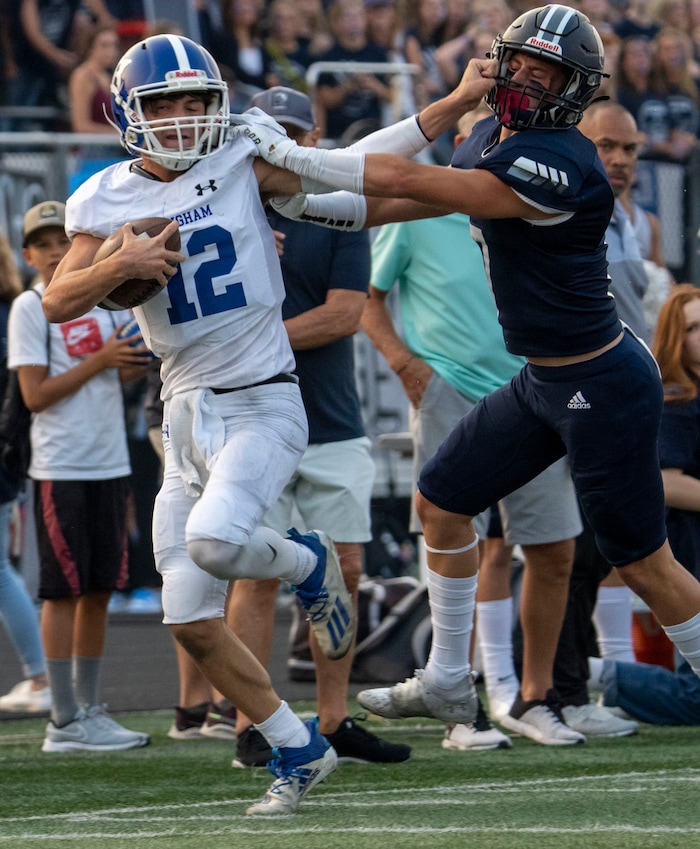 (Rick Egan | The Salt Lake Tribune) Dallen Martinez gets past Corner Canyon free safety Charlie Ebeling (7) as he runs the ball for the Chargers, in prep football action between the Corner Canyon Chargers and the Bingham Miners, on Friday, Aug. 27, 2021.