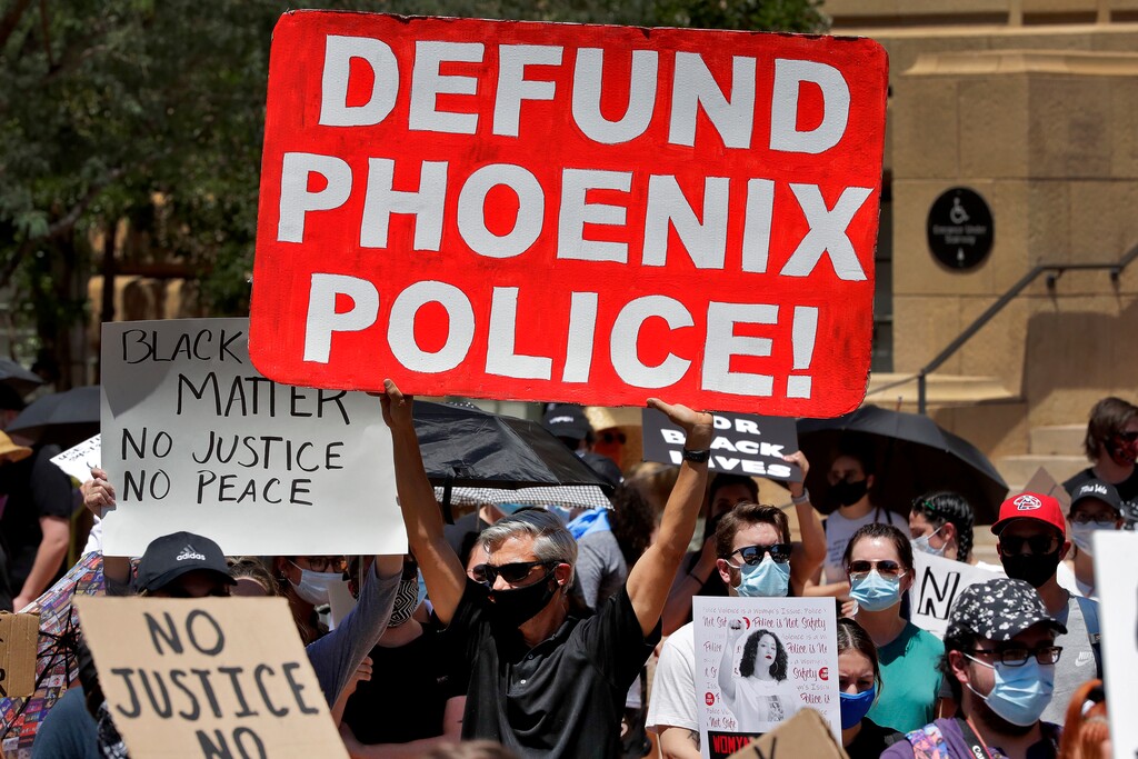 (Matt York | AP file photo) Protesters rally Wednesday, June 3, 2020, in Phoenix, demanding that the Phoenix City Council defund the Phoenix Police Department.