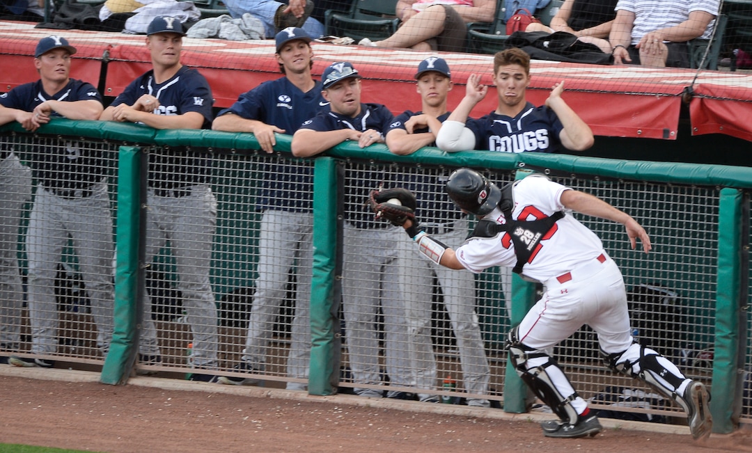 (Francisco Kjolseth  |  The Salt Lake Tribune)  Utah's Zack Moeller gets a fly ball in front of the BYU dugout as Utah and BYU renew their rivalry on the baseball diamond as they battle it out at Smith's Ballpark in Salt Lake City on Tuesday, May 14, 2019.