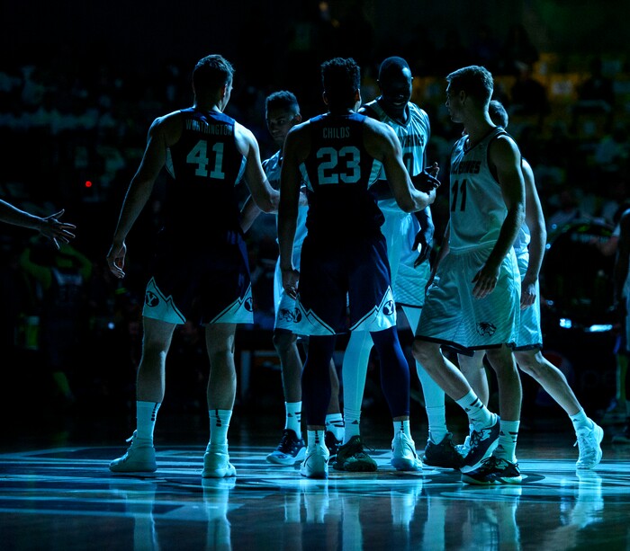 (Steve Griffin  |  The Salt Lake Tribune) Players shake hands as the lights come up at the start of the BYU versus UVU basketball game at UCCU Center on the UVU campus in Orem Wednesday November 29, 2017.