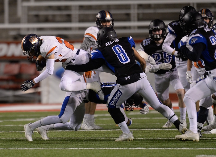 (Francisco Kjolseth  |  The Salt Lake Tribune)  Jace Dart of Mountain Crest tries to push past  Stansbury in their class 4A semifinal game at Rice-Eccles Stadium, Thursday, Nov. 9, 2017.