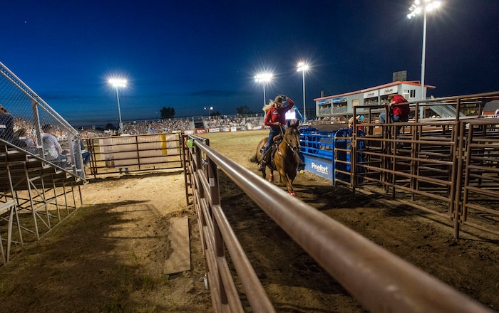 (Rick Egan  |  The Salt Lake Tribune)     A barrel racer finishes her competition, at the West Jordan Western Stampede Rodeo, Saturday, July 6, 2019.