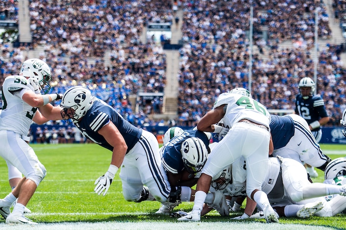 (Chris Detrick  |  The Salt Lake Tribune) Brigham Young Cougars running back Squally Canada (22) scores a touchdown during the game at LaVell Edwards Stadium Saturday, August 26, 2017.