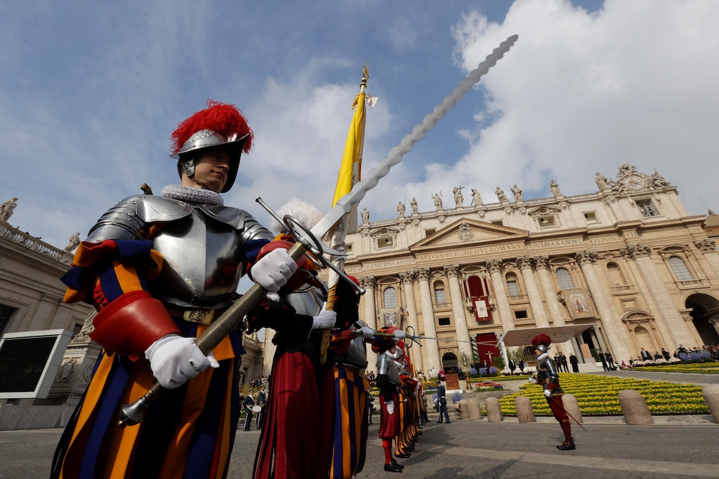 Swiss Guards stand in front of St. Peter's Basilica at the Vatican, Sunday, April 16, 2017 (AP Photo/Gregorio Borgia)