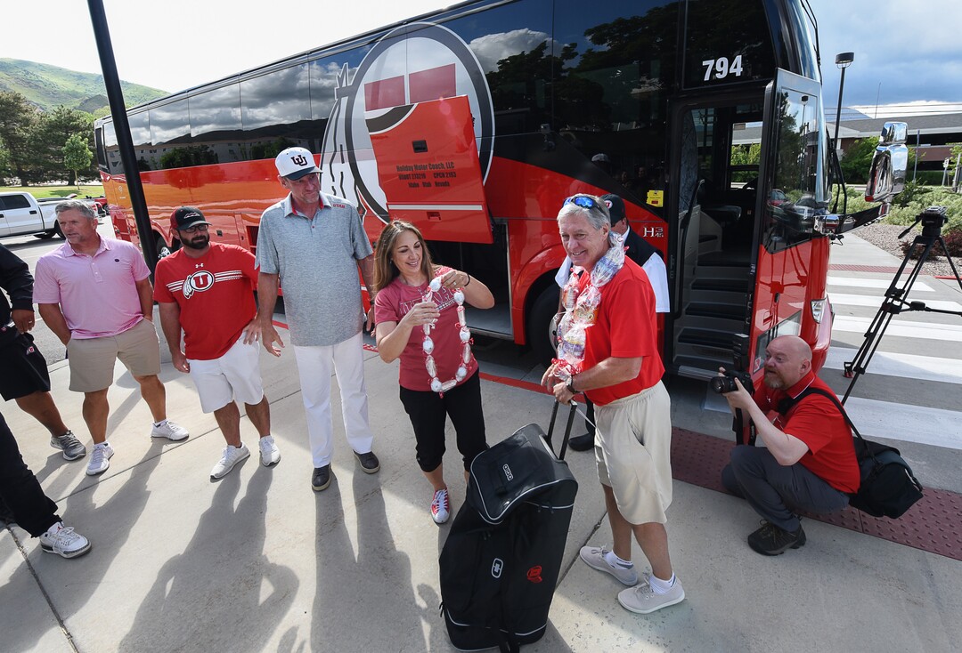 (Francisco Kjolseth  |  The Salt Lake Tribune)  University of Utah athletic director Chris Hill says goodbye to friends and staff at the Huntsman Center on Friday, June 1, 2018, as he gets ready to climb aboard a red Ute-branded Holiday Motor coach bus to the sounds of cheers and applause after 31 years on the job.