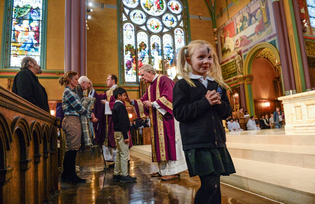 (Leah Hogsten  |  The Salt Lake Tribune) Students from The Madeleine Choir School receive their ashen signs of the cross during noon Mass on Ash Wednesday, Feb. 26, 2020, at the Cathedral of the Madeleine.