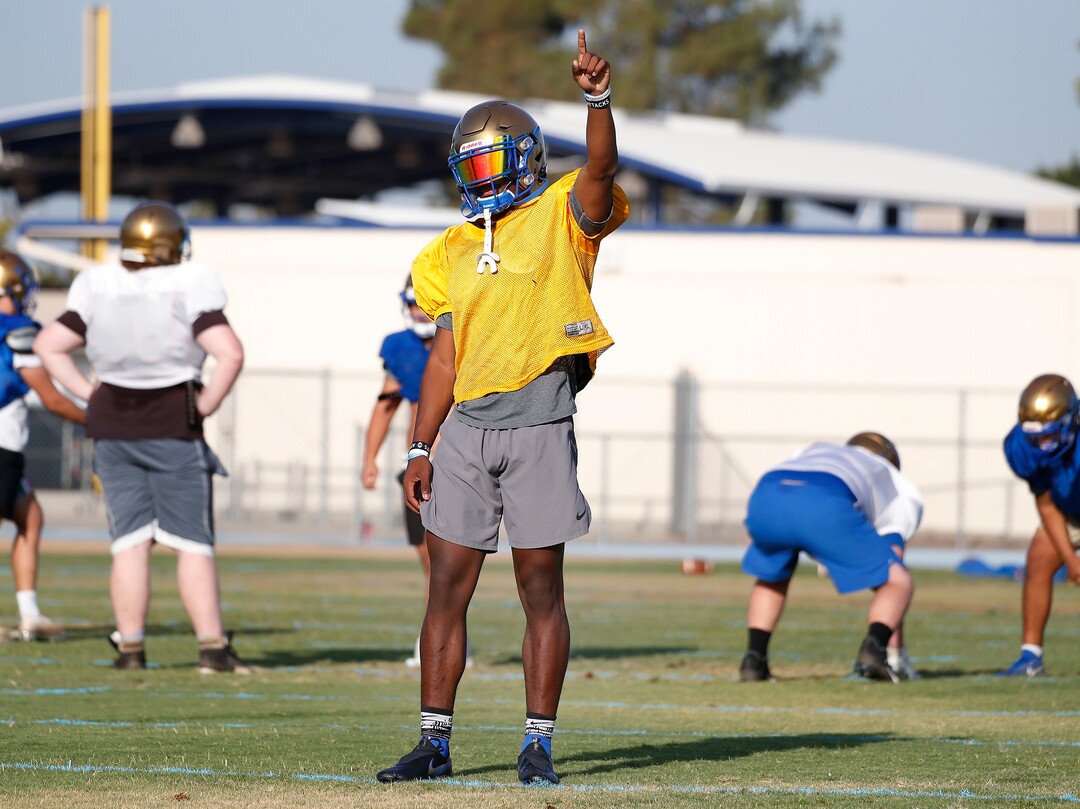 (Gary Kazanjian | Special to The Tribune) Clovis High School quarterback Nate Johnson works out with his team at Clovis High School, who committed to play for the University of Utah, shown Wednesday, July 28, 2021, in Clovis, Calif.