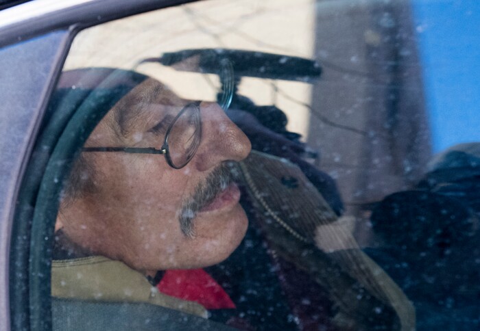 (Rick Egan  |  The Salt Lake Tribune)  Jackie Sanchez waits in the squad car, while the police talk to the media, after being arrested by Salt Lake City police, after a media conference in his attorney's office about an abuse of force claim against the Salt Lake City Police, after Sanchez was attacked by a police dog on July 28. Wednesday, December 6, 2017.


