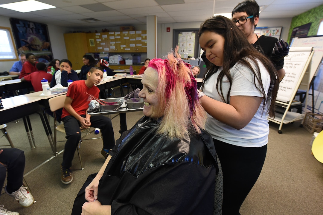 (Francisco Kjolseth  |  The Salt Lake Tribune)  Miriam Lazalde, 12, gets a chance to put in some bright pink color into teacher Sharon Moore's hair after the 6th grade teacher at North Star Elementary agreed to the dye on Tuesday, May 8, 2018, after the students SAGE scores went up nearly 17 percent.