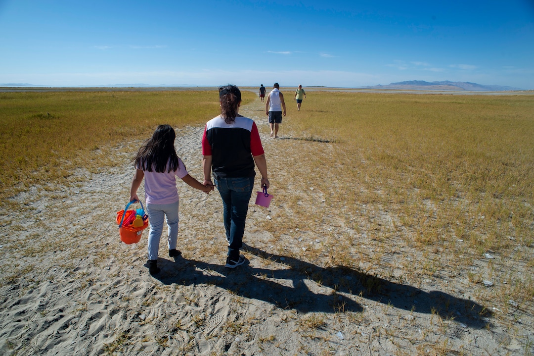 (Rick Egan  |  The Salt Lake Tribune)    Monica and Monique Manilla lake the long walk out to the water to enjoy the nice fall weather at the Great Salt Lake. Wednesday, Sept. 18, 2019.