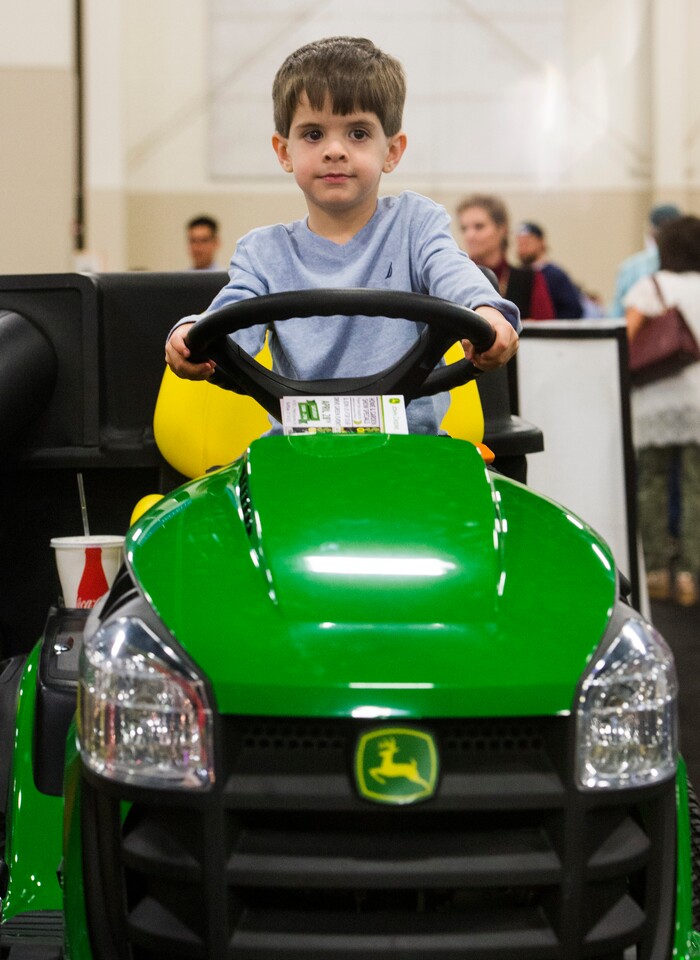 (Rick Egan  |  The Salt Lake Tribune)   Five-Year-Old Elijah Martinez from Sandy, sits on a tractor at the Salt Lake Tribune Home & Garden show, at the Mountain America Expo Center in Sandy, Saturday, March 10, 2018.