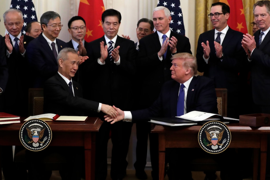 (Evan Vucci | AP) President Donald Trump shakes hands with Chinese Vice Premier Liu He, after signing a trade agreement in the East Room of the White House, Wednesday, Jan. 15, 2020, in Washington.