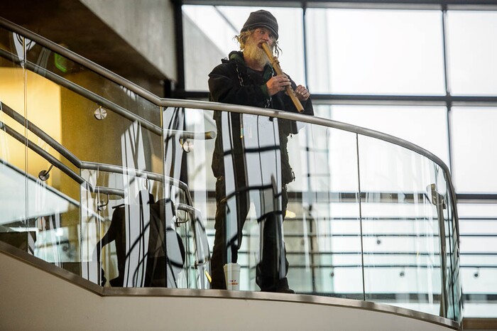 (Trent Nelson | The Salt Lake Tribune)  
Wolf plays a flute during a tai chi class for homeless people at the Main Library in Salt Lake City on Wednesday April 3, 2019.
