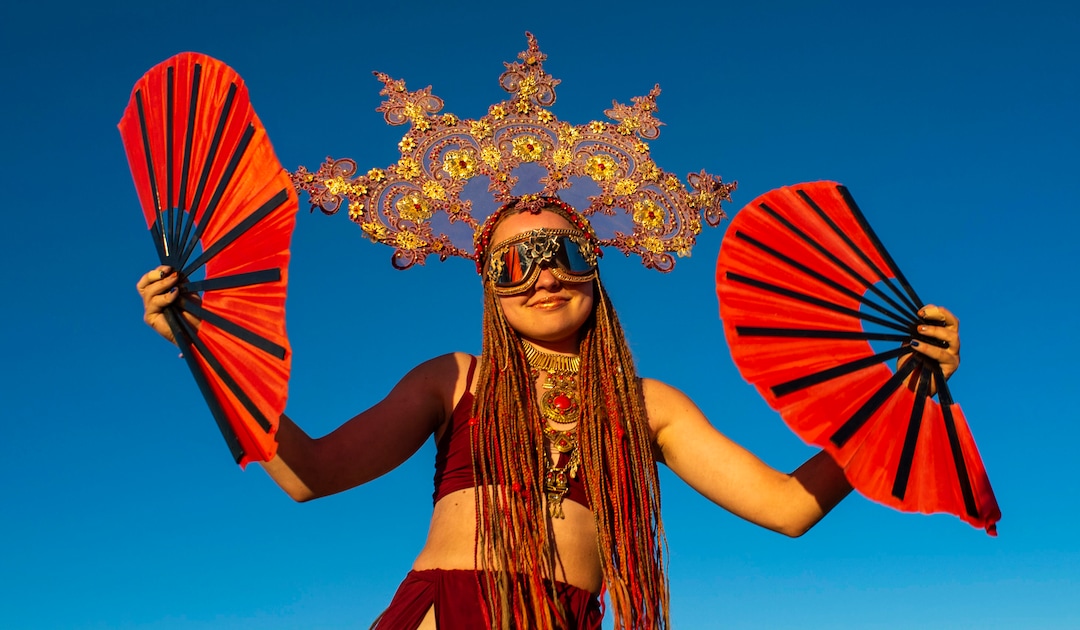 (Rick Egan  |  The Salt Lake Tribune)   Maria Zarieskiya from Moscow Russia, dancing at sunrise, at Burning Man, Friday, Aug. 30, 2019.