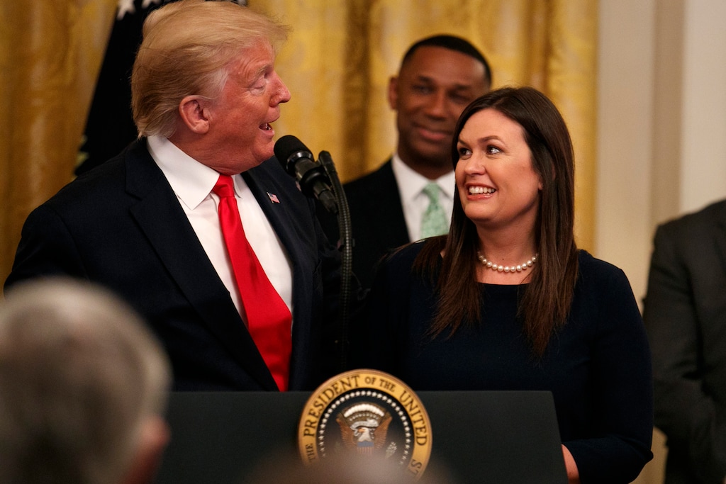 President Donald Trump welcomes White House press secretary Sarah Sanders to the stage as he pauses from speaking about second chance hiring to publicly thank the outgoing press secretary in the East Room of the White House, Thursday June 13, 2019, in Washington. (AP Photo/Jacquelyn Martin)