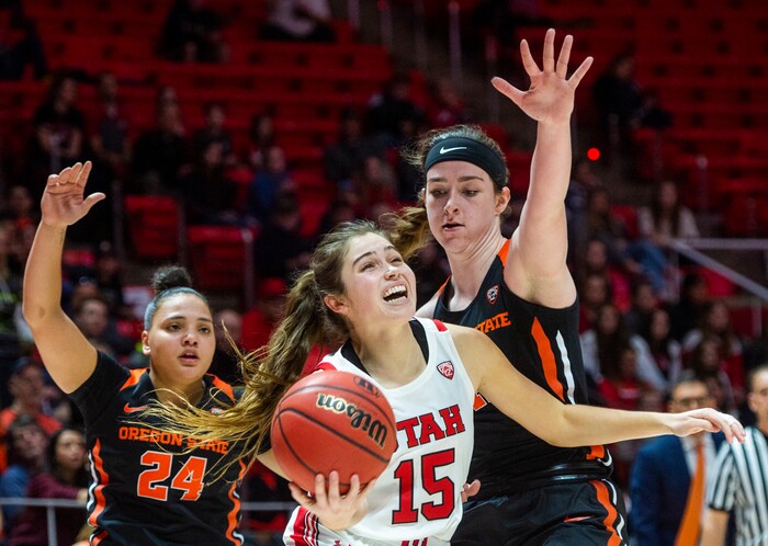 (Rick Egan  |  The Salt Lake Tribune)     Utah Utes guard Kemery Martin (15) takes the ball to the hoop, as Oregon State guard Destiny Slocum (24) and  forward Kennedy Brown (42) defend for the Beavers, in PAC-12 basketball action between the Utah Utes and the Oregon State Beavers at the Jon M. Huntsman Center, Saturday, Feb. 1, 2020.